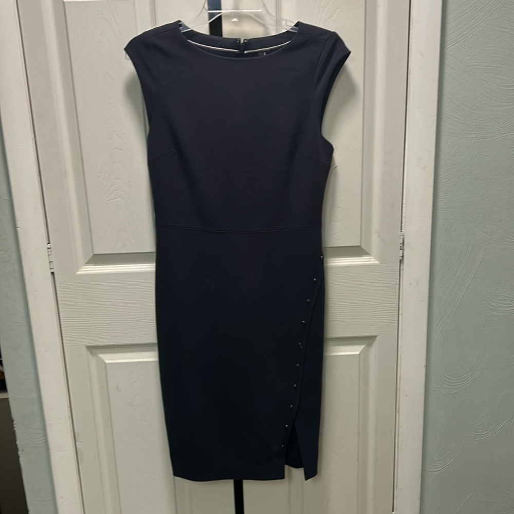 Limited Navy Blue Mad Men style shift dress. Size 4. Button skirt detail.